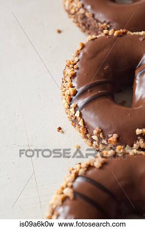Close up of decorated doughnuts View Large Photo Image Stock Photo - Close up of decorated doughnuts. Fotosearch