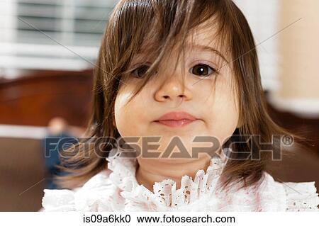 Close up of girl's skeptical face View Large Photo Image Stock Image - Close up of girl's skeptical face. Fotosearch