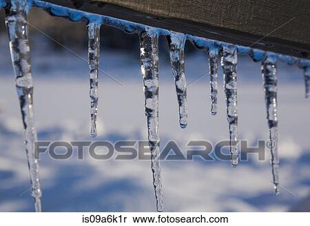 Close up of icicles hanging from house View Large Photo Image Stock Photography - Close up of icicles hanging from house. Fotosearch