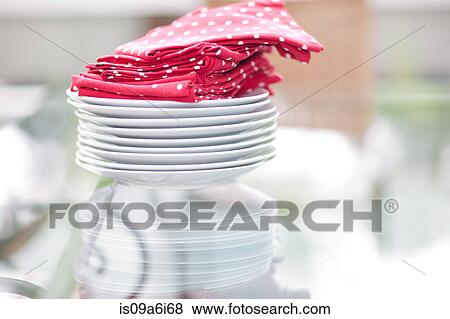 Close up of napkins and plates on table View Large Photo Image Stock Photo - Close up of napkins and plates on table. Fotosearch