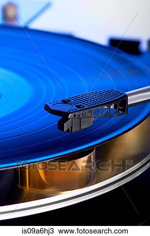 Stock Image - Close up of record in player. Fotosearch