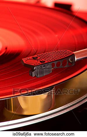 Stock Image - Close up of record in player. Fotosearch