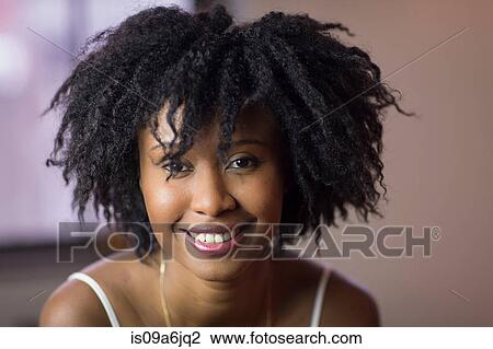 Stock Image - Close up of smiling woman's face. Fotosearch