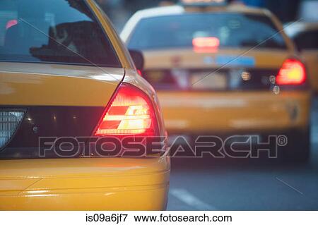 Stock Photo - Close up of taxi brake lights. Fotosearch