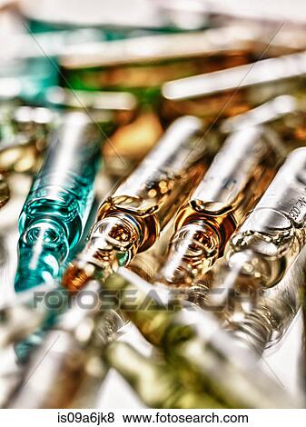 Stock Photo - Close up of vials of liquid. Fotosearch