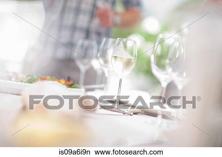 Close up of wine glasses on table View Large Photo Image Picture - Close up of wine glasses on table. Fotosearch