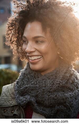 Stock Image - Close up of woman's smiling face. Fotosearch