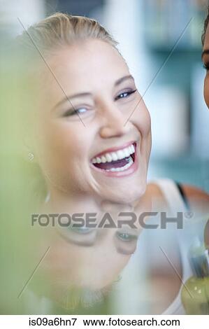 Stock Photo - Close up of woman's smiling face. Fotosearch