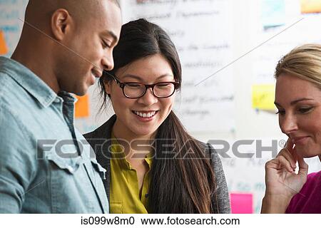 Colleagues discussing business View Large Photo Image Stock Image - Colleagues discussing business. Fotosearch