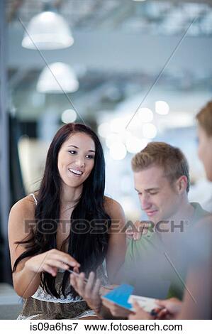Stock Photo - Couple examining swatches in store. Fotosearch