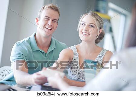 Couple looking at paint swatches View Large Photo Image Stock Image - Couple looking at paint swatches. Fotosearch