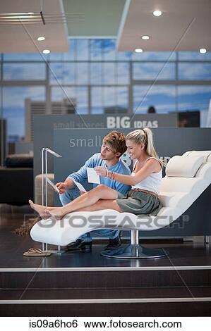 Couple shopping for furniture in store View Large Photo Image Stock Photograph - Couple shopping for furniture in store. Fotosearch