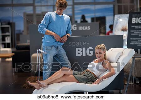 Stock Photography - Couple shopping for furniture in store. Fotosearch