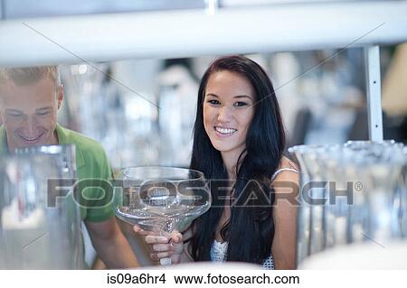 Picture - Couple shopping for kitchenware in store. Fotosearch