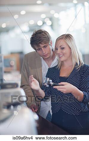 Picture - Couple shopping for kitchenware in store. Fotosearch