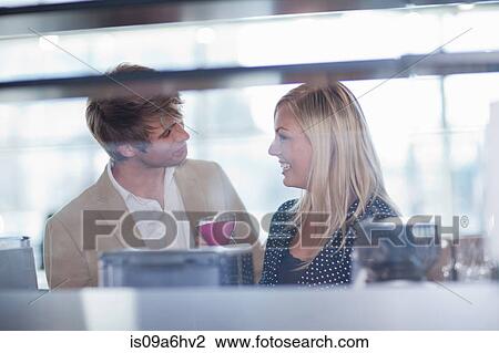 Stock Image - Couple shopping for kitchenware in store. Fotosearch