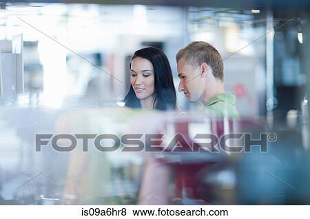 Couple shopping for kitchenware in store View Large Photo Image Stock Photo - Couple shopping for kitchenware in store. Fotosearch