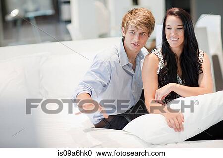 Couple shopping for mattress in store View Large Photo Image Stock Image - Couple shopping for mattress in store. Fotosearch