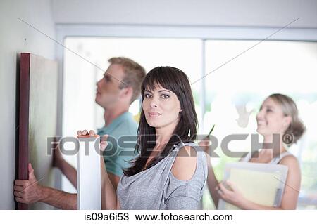 Couple working with interior designer View Large Photo Image Stock Image - Couple working with interior designer. Fotosearch