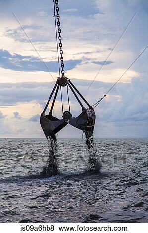 Stock Photo - Crane operating in water. Fotosearch