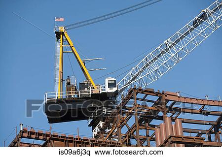Stock Photography - Crane over construction site. Fotosearch