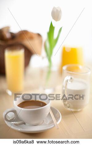 Cup of coffee with milk and orange juice View Large Photo Image Stock Photo - Cup of coffee with milk and orange juice. Fotosearch