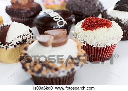 Decorated cupcakes on counter View Large Photo Image Stock Image - Decorated cupcakes on counter. Fotosearch