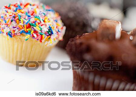 Stock Photograph - Decorated cupcakes on counter. Fotosearch