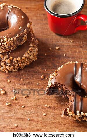 Decorated doughnuts and coffee View Large Photo Image Stock Image - Decorated doughnuts and coffee. Fotosearch