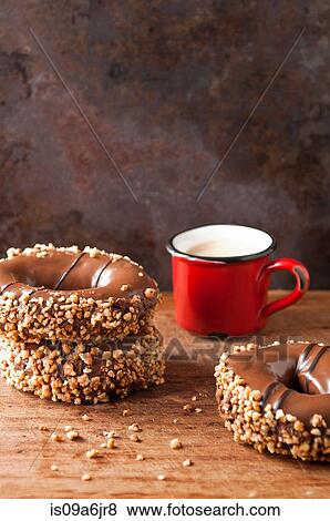 Decorated doughnuts and coffee View Large Photo Image Stock Photo - Decorated doughnuts and coffee. Fotosearch