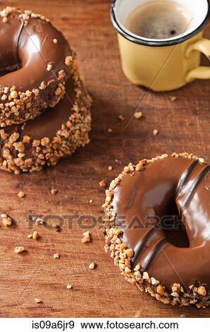 Stock Photo - Decorated doughnuts and coffee. Fotosearch