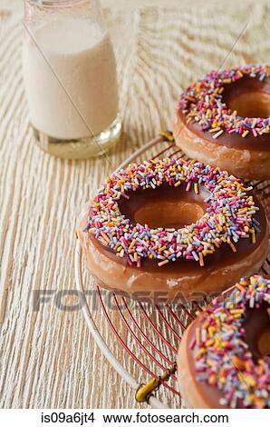 Decorated doughnuts and milk View Large Photo Image Picture - Decorated doughnuts and milk. Fotosearch
