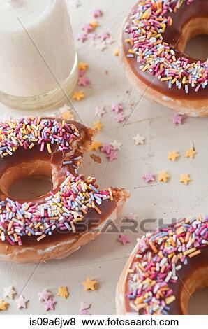 Decorated doughnuts and milk View Large Photo Image Stock Photo - Decorated doughnuts and milk. Fotosearch
