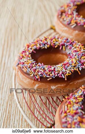 Decorated doughnuts View Large Photo Image Stock Photograph - Decorated doughnuts. Fotosearch