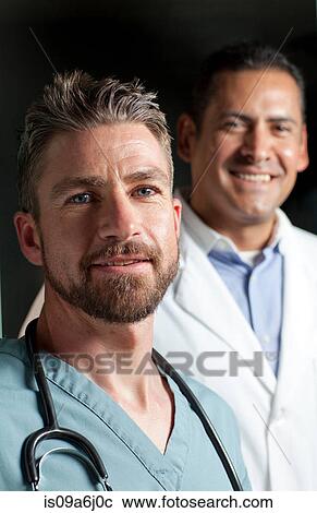 Stock Image - Doctors smiling together. Fotosearch