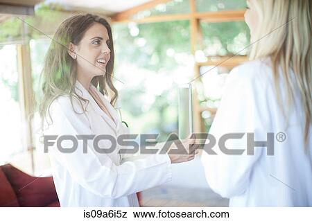 Doctors using tablet computer View Large Photo Image Stock Photo - Doctors using tablet computer. Fotosearch