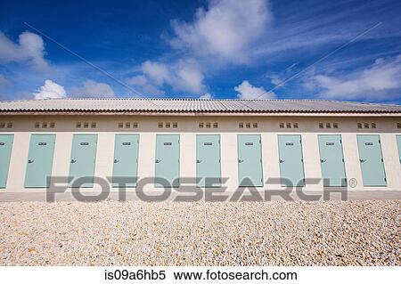 Stock Photography - Doors of building on rocky beach. Fotosearch