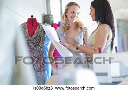 Dressmaker fitting client in studio View Large Photo Image Stock Image - Dressmaker fitting client in studio. Fotosearch