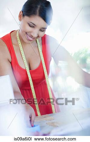 Dressmaker working in studio View Large Photo Image Stock Image - Dressmaker working in studio. Fotosearch