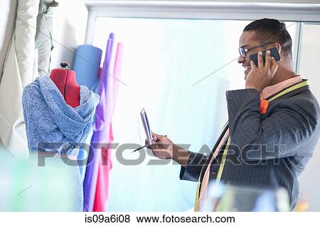 Dressmaker working in studio View Large Photo Image Stock Photo - Dressmaker working in studio. Fotosearch
