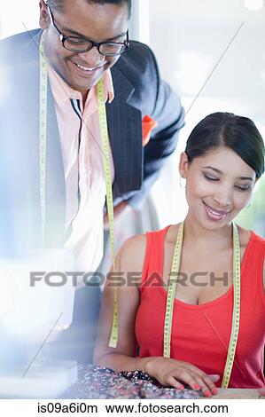 Picture - Dressmakers working in studio. Fotosearch