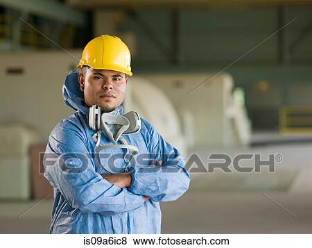 Stock Photo - Engineer wearing protective suit on site. Fotosearch