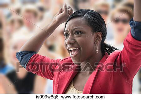 Excited woman in crowd View Large Photo Image Stock Photograph - Excited woman in crowd. Fotosearch