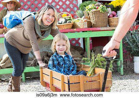 Picture - Family shopping at farmer's market. Fotosearch