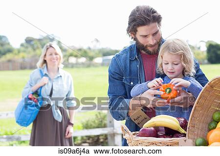 Family shopping at farmer's market View Large Photo Image Stock Image - Family shopping at farmer's market. Fotosearch