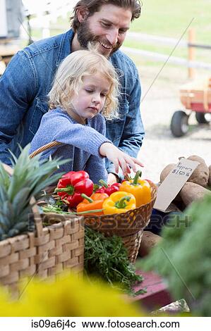 Father and son at farmer's market View Large Photo Image Stock Image - Father and son at farmer's market. Fotosearch