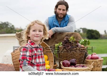 Father and son with produce in truck bed View Large Photo Image Stock Photo - Father and son with produce in truck bed. Fotosearch