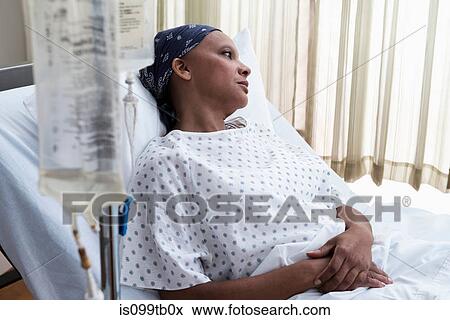 Stock Photo - Female hospital patient in bed. Fotosearch