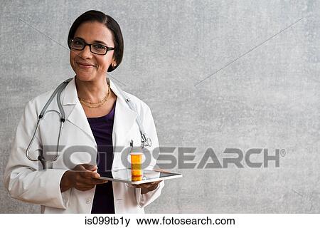 Female with digital tablet and medicine View Large Photo Image Stock Photo - Female with digital tablet and medicine. Fotosearch