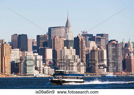 Stock Photo - Ferry boat and New York City skyline. Fotosearch